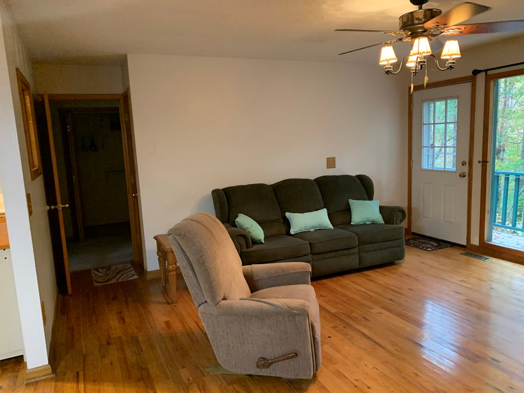 55 Laurel Spring Drive Murphy, NC 28906 - Photo 21 of 73 a living room with furniture and a wooden floor