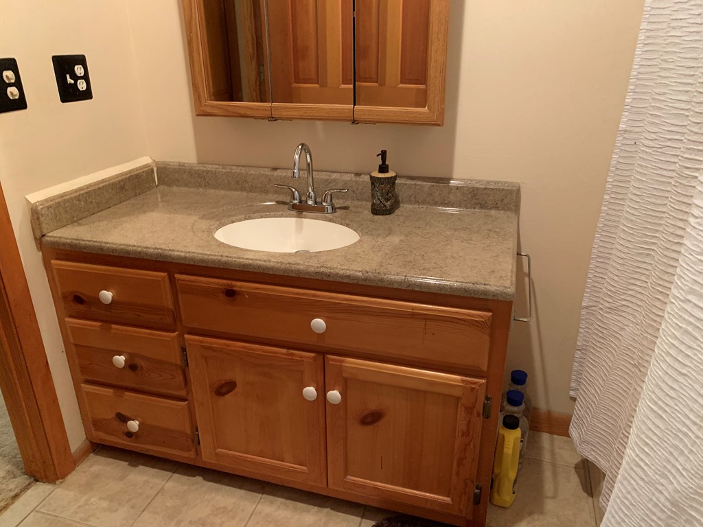 55 Laurel Spring Drive Murphy, NC 28906 - Photo 26 of 73 a bathroom with a sink and a mirror