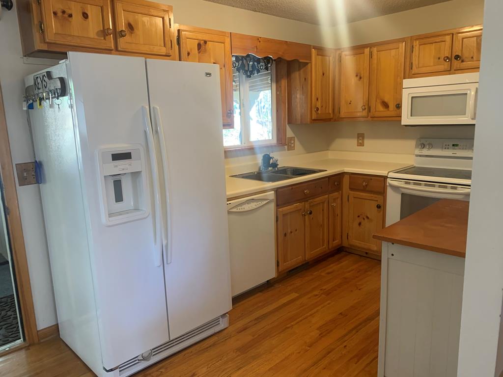 55 Laurel Spring Drive Murphy, NC 28906 - Photo 72 of 73 a kitchen with stainless steel appliances a refrigerator a sink and wooden cabinets