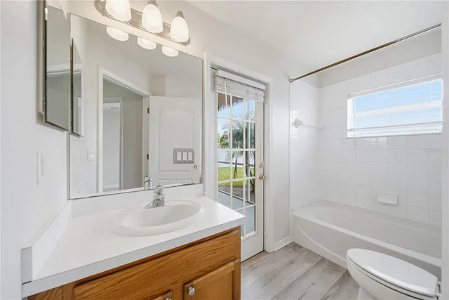 a bathroom with a sink a toilet and a bathtub