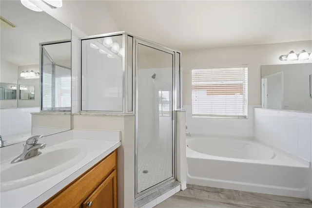 a bathroom with a bathtub and a sink