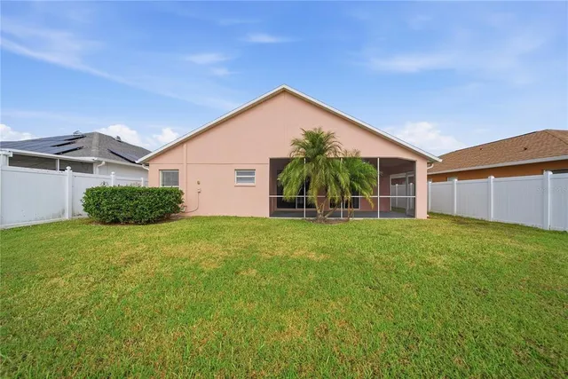 a view of a lake with houses in the back