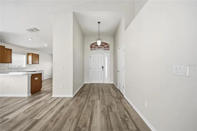 a view of a kitchen from the hallway