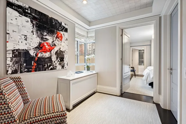 a view of a hallway with bathroom