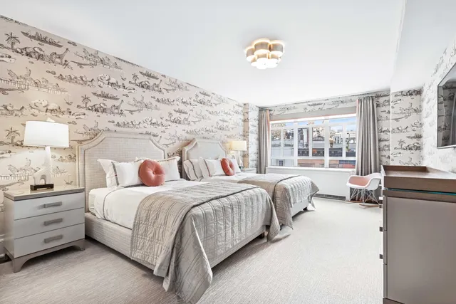 a bedroom with bed and a large window