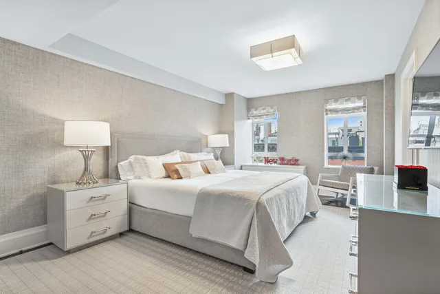 a bedroom with bed and window