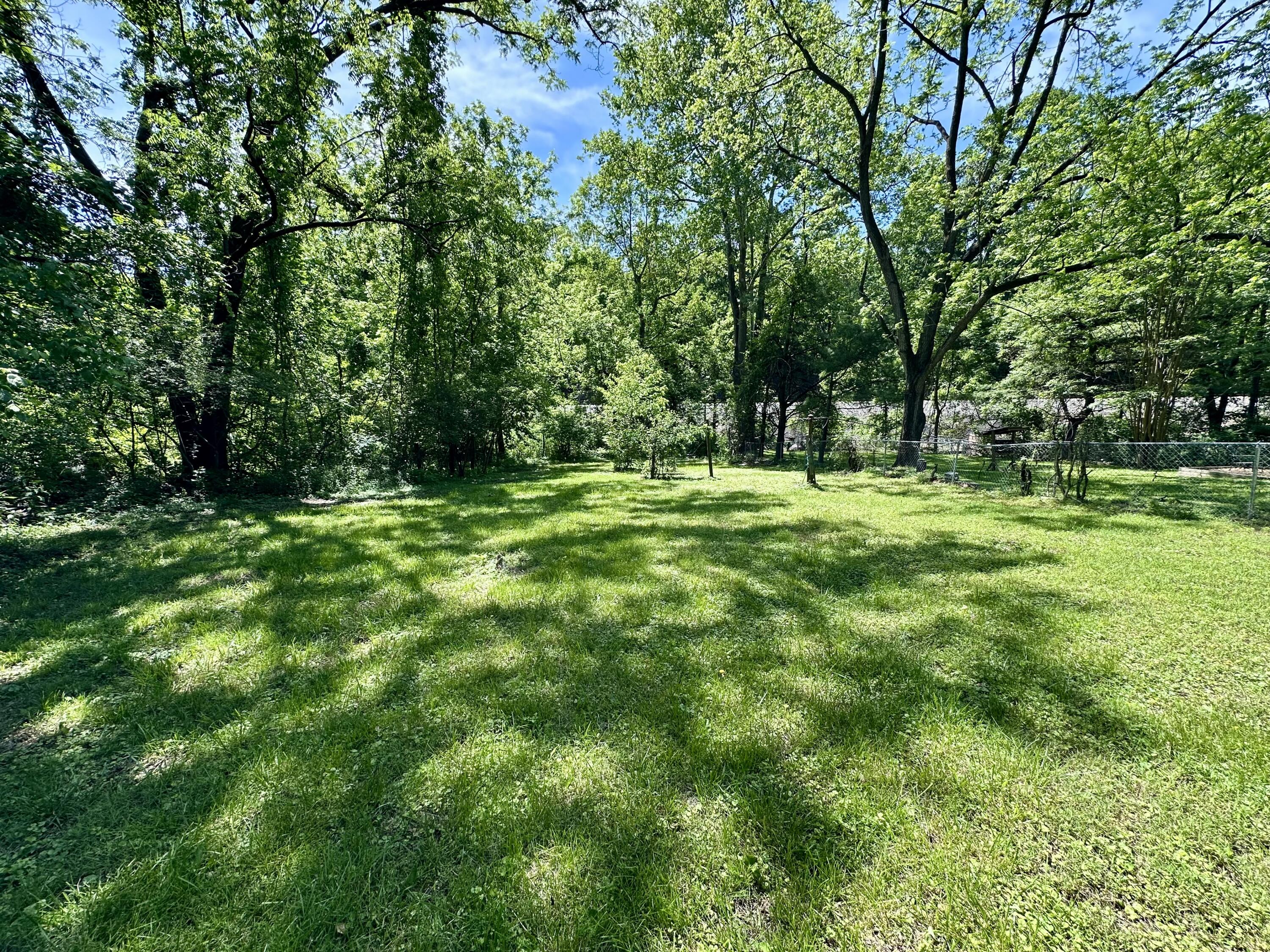1074 Lynn Lane Blue Ridge, VA 24064 - Photo 2 of 6 a big yard with lots of green space and trees