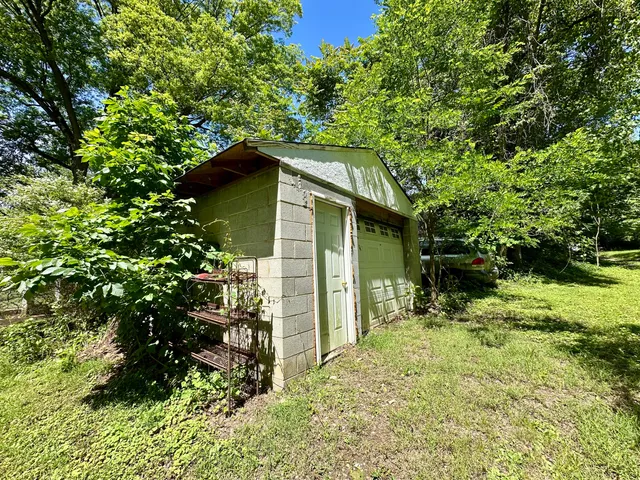 a backyard of a house with lots of green space