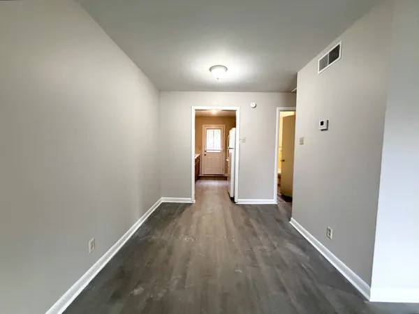 a view of wooden floor in an empty room