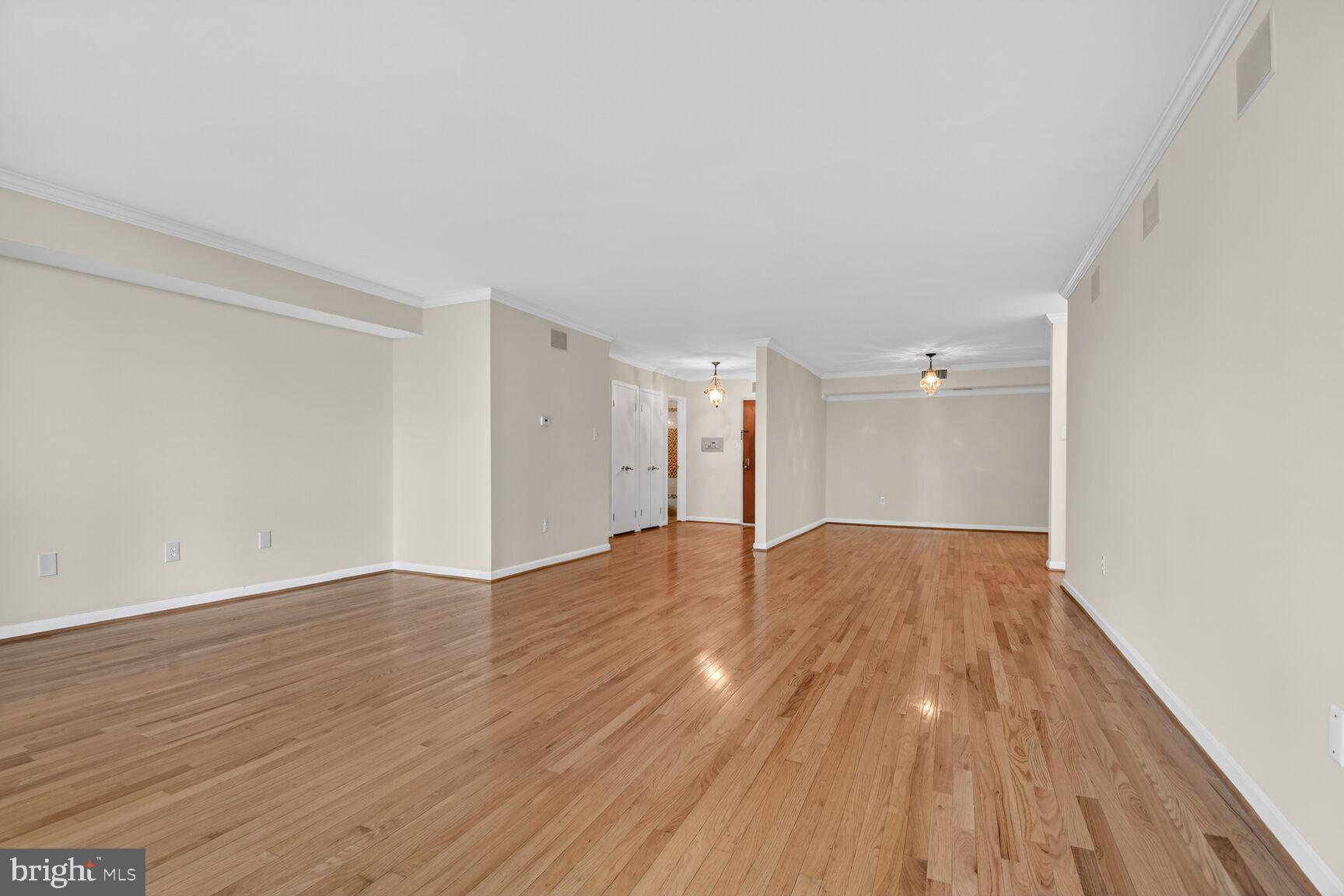 1101 South Arlington Ridge Road, Unit 504 Arlington, VA 22202 - Photo 11 of 37 a view of an empty room and wooden floor