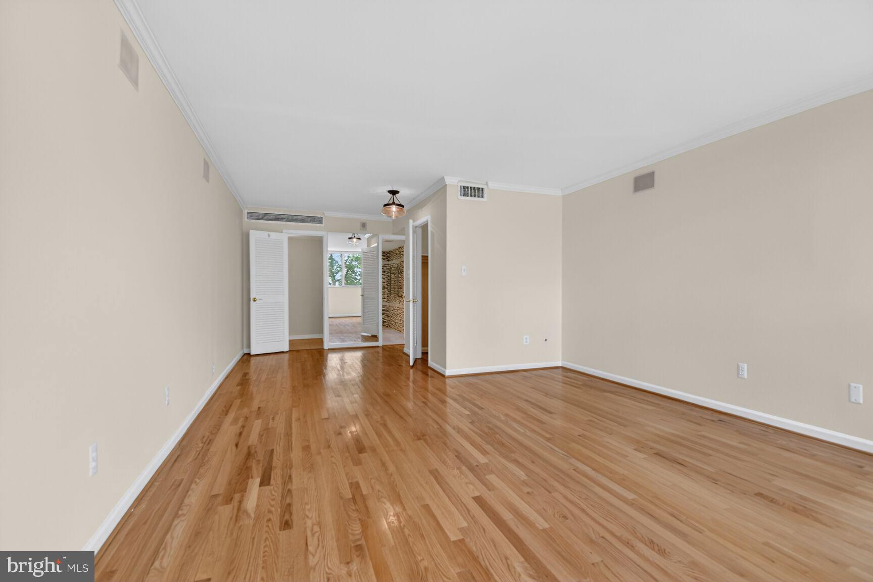 1101 South Arlington Ridge Road, Unit 504 Arlington, VA 22202 - Photo 17 of 37 a view of an empty room with wooden floor
