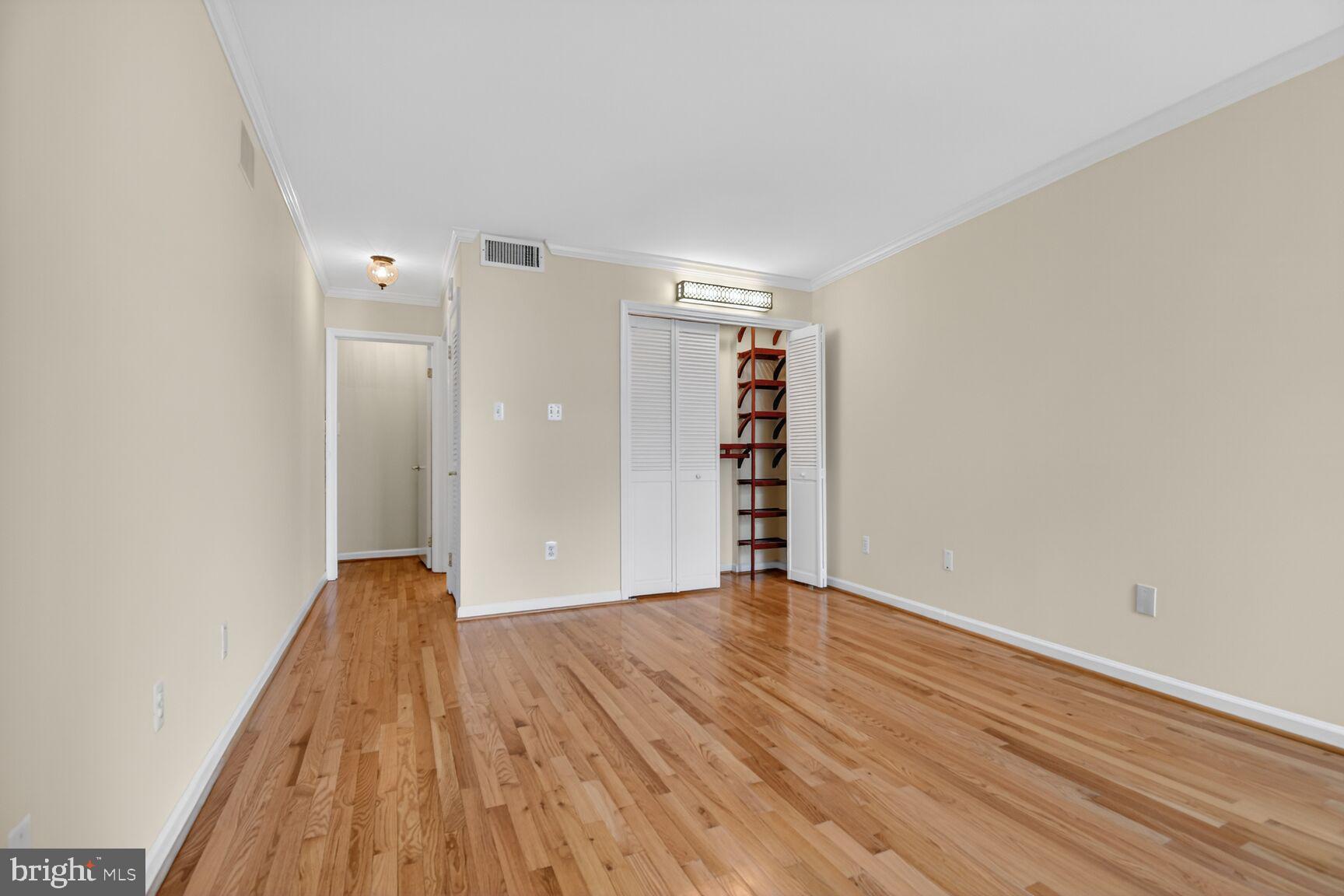 1101 South Arlington Ridge Road, Unit 504 Arlington, VA 22202 - Photo 22 of 37 a view of empty room with wooden floor