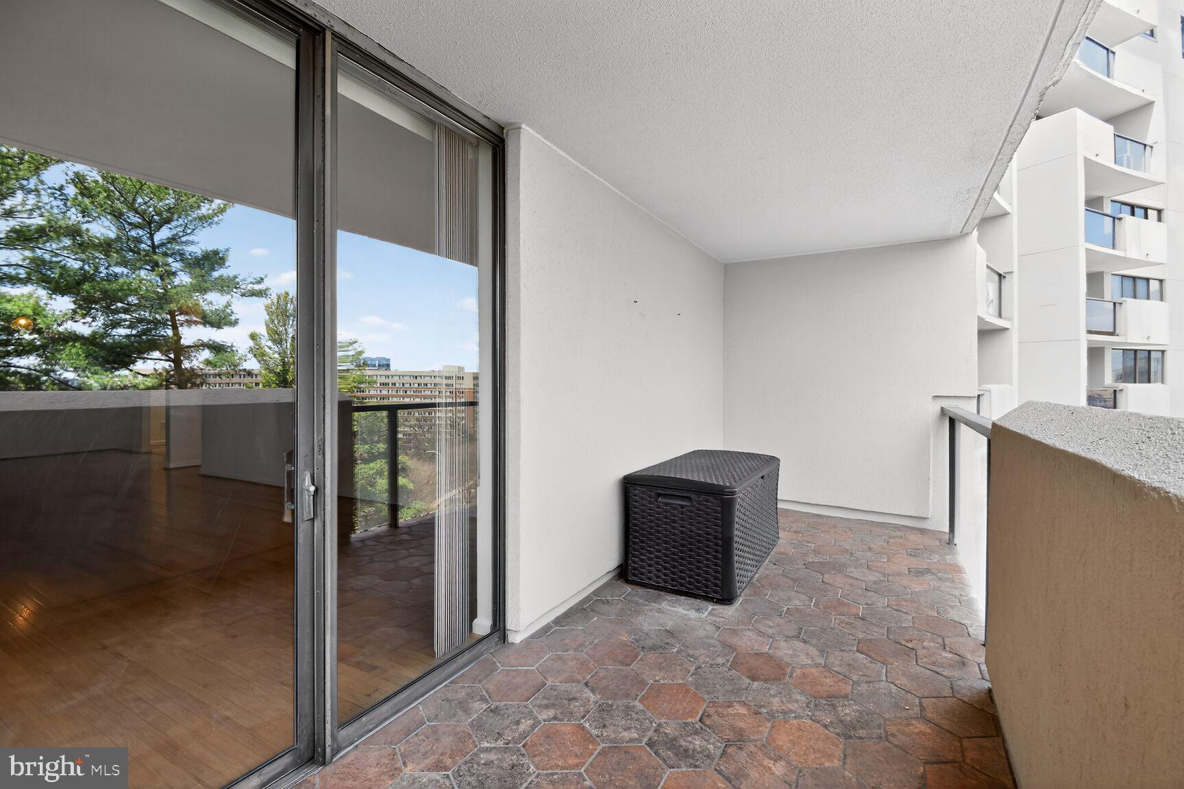 1101 South Arlington Ridge Road, Unit 504 Arlington, VA 22202 - Photo 24 of 37 a view of kitchen with refrigerator and table