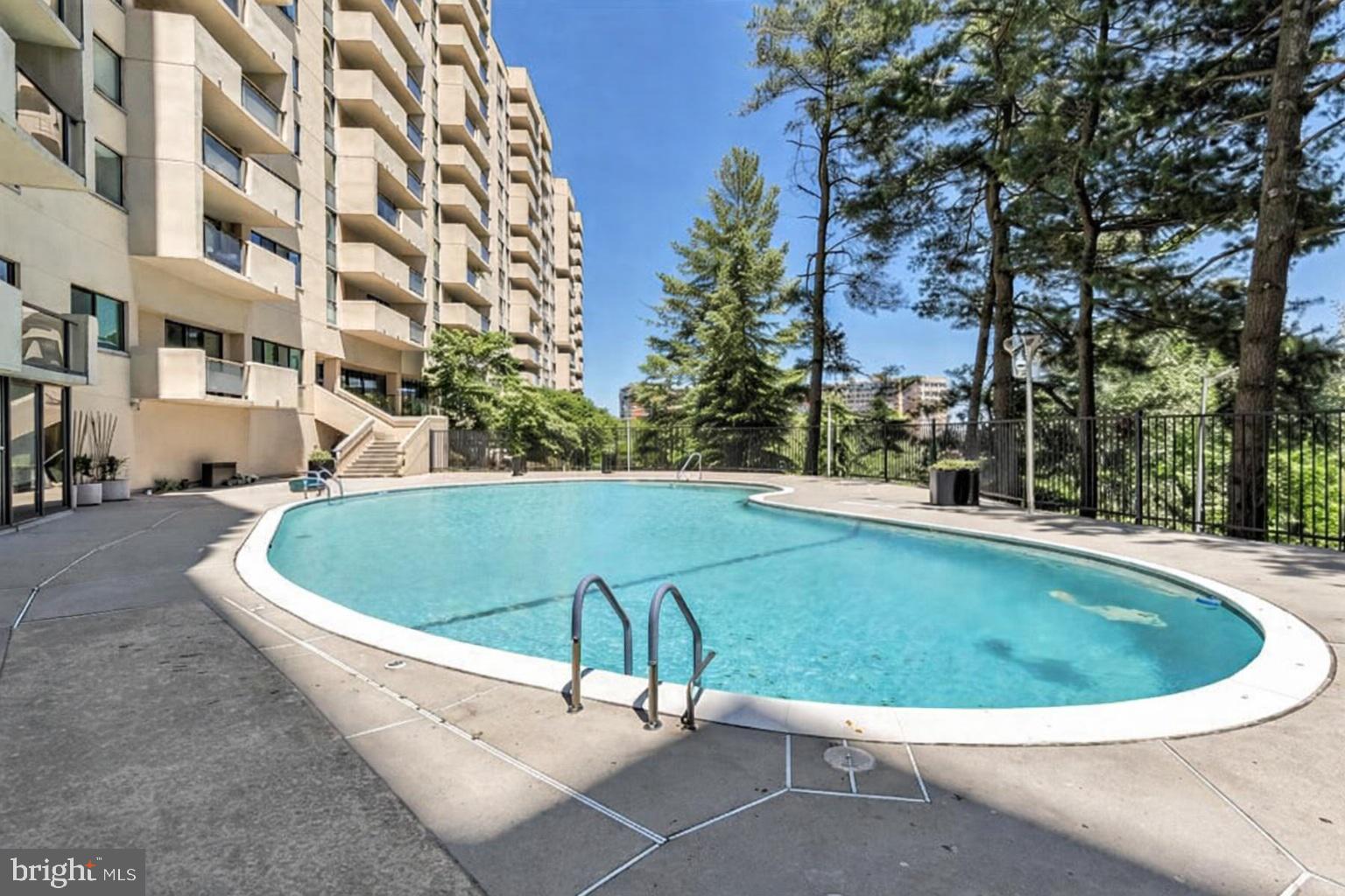 1101 South Arlington Ridge Road, Unit 504 Arlington, VA 22202 - Photo 36 of 37 a view of a swimming pool with a yard