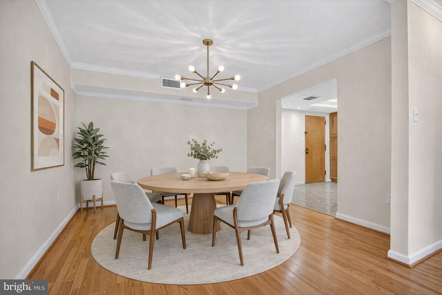 1101 South Arlington Ridge Road, Unit 504 Arlington, VA 22202 - Photo 7 of 37 a view of a dining room with furniture and wooden floor