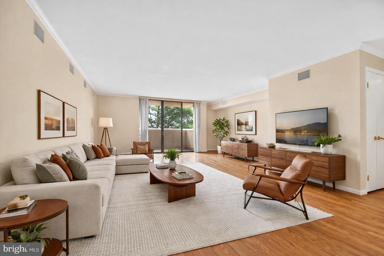 1101 South Arlington Ridge Road, Unit 504 Arlington, VA 22202 - Photo 9 of 37 a living room with furniture and a flat screen tv