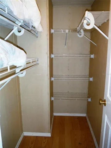 a bedroom with a bed and dresser