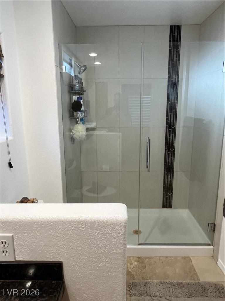 11021 Rackhurst Avenue Las Vegas, NV 89134 - Photo 14 of 53 Main Bath has tiled shower