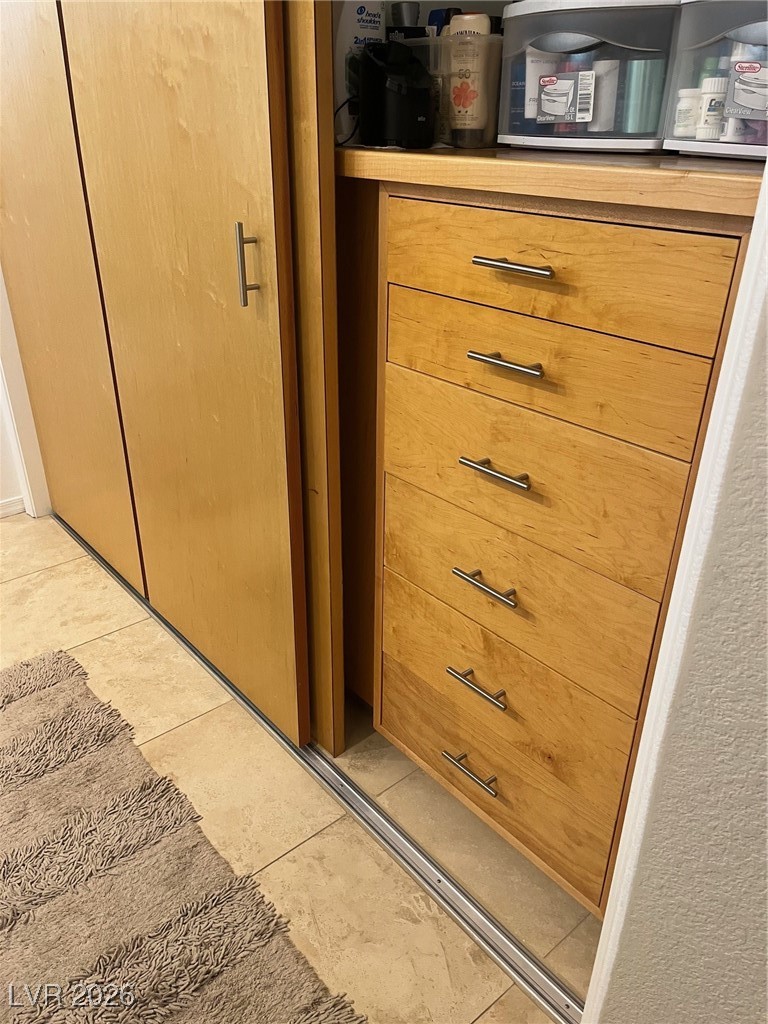 11021 Rackhurst Avenue Las Vegas, NV 89134 - Photo 16 of 53 custom cabinets in half of the large walk-in closet