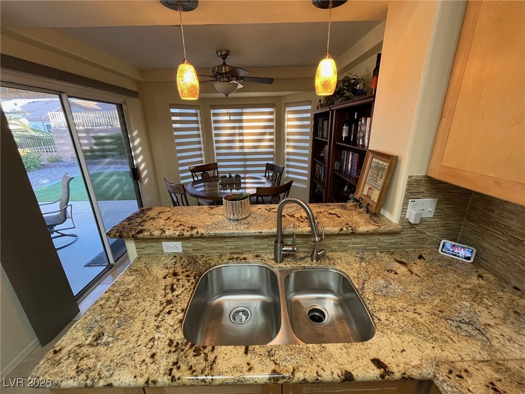 11021 Rackhurst Avenue Las Vegas, NV 89134 - Photo 18 of 53 Kitchen has nice granite and breakfast counter