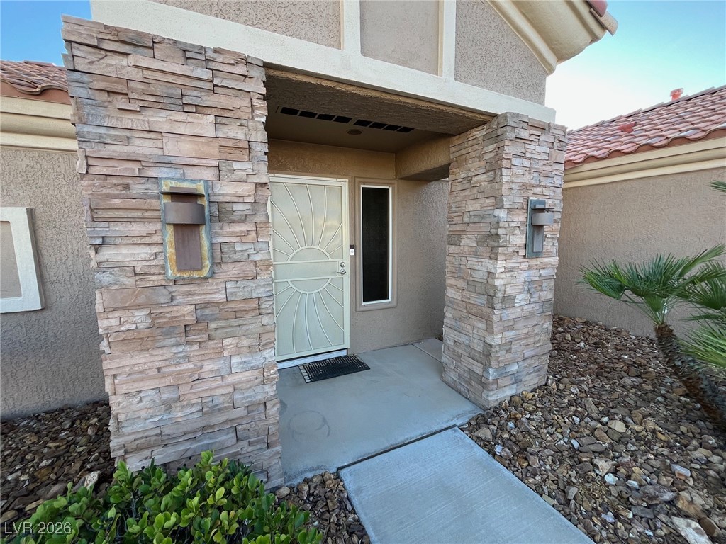 11021 Rackhurst Avenue Las Vegas, NV 89134 - Photo 21 of 53 Front Entry has designer lighting and stacked stone