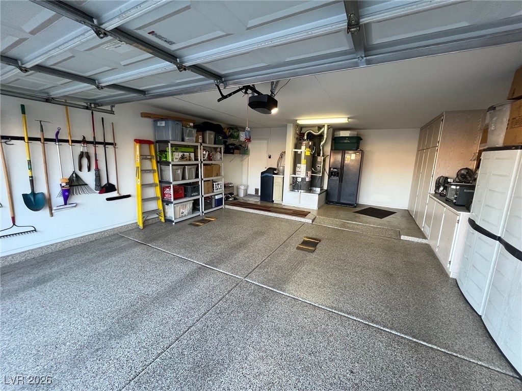 11021 Rackhurst Avenue Las Vegas, NV 89134 - Photo 22 of 53 Large Garage with Epoxy Flooring. Workspace and storage cabinetry
