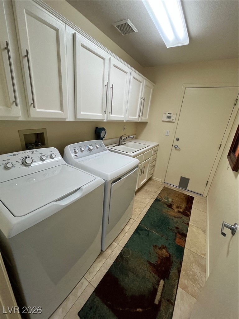 11021 Rackhurst Avenue Las Vegas, NV 89134 - Photo 36 of 53 Utility Room has lots of cabinets, tile and Washer/Dryer (included)