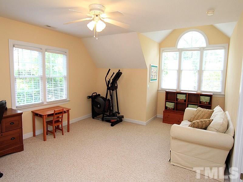 6725 Hammersmith Drive Raleigh, NC 27613 - Photo 14 of 17 a livingroom with workspace and a window
