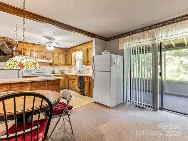 a dining table chair next to a window