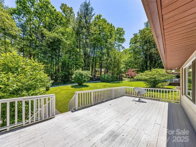 a view of a deck with a yard