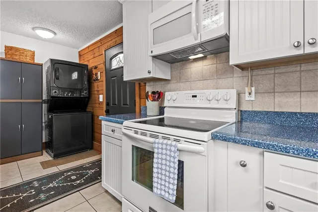 a kitchen with appliances cabinets and a counter top space