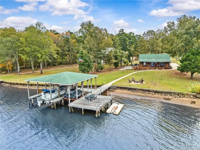 an outdoor space with swimming pool and furniture