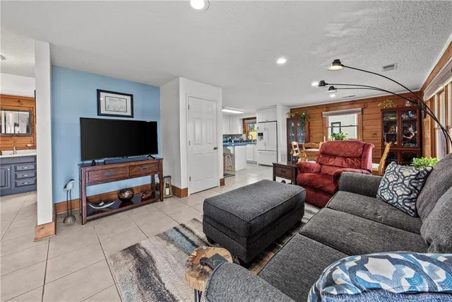 a bedroom with a bed and a mirror