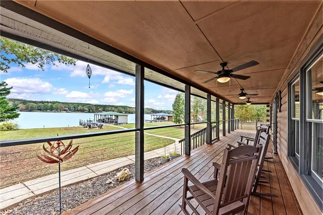 a view of a patio with dining table and chairs