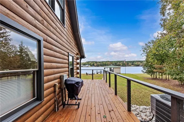 a view of a lake with houses in the back