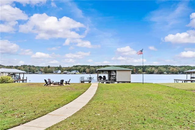 a view of a swimming pool with a table and chairs