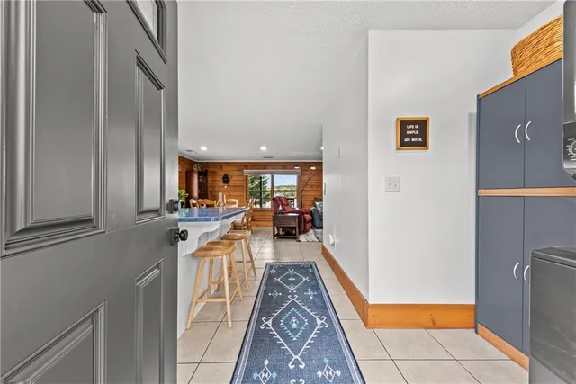 a hallway with a sink and cabinets