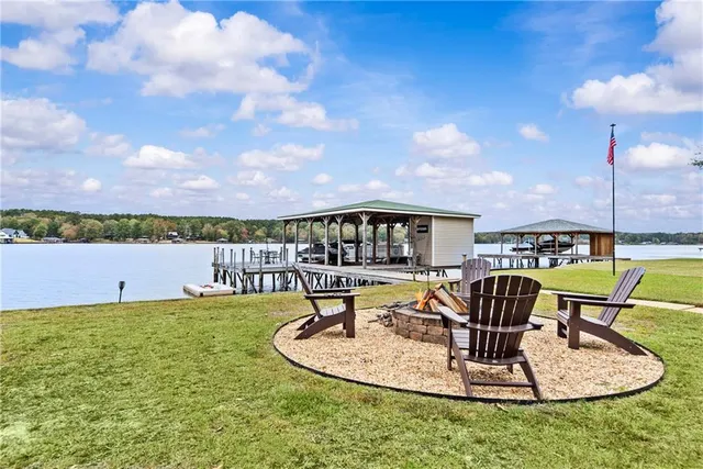a view of a swimming pool with sitting area