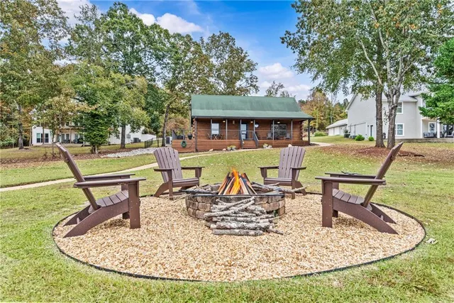 a view of a swimming pool with an outdoor seating