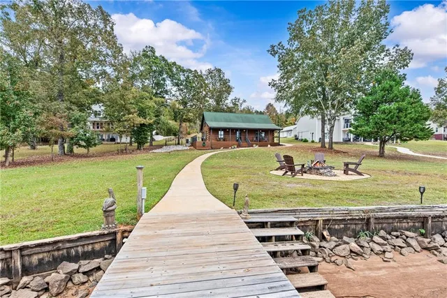 a view of a street with large trees