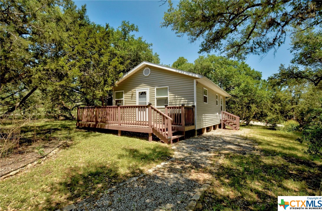 140 Acree Acres Road Johnson City, TX 78636 - Photo 1 of 1 a view of a house with a yard
