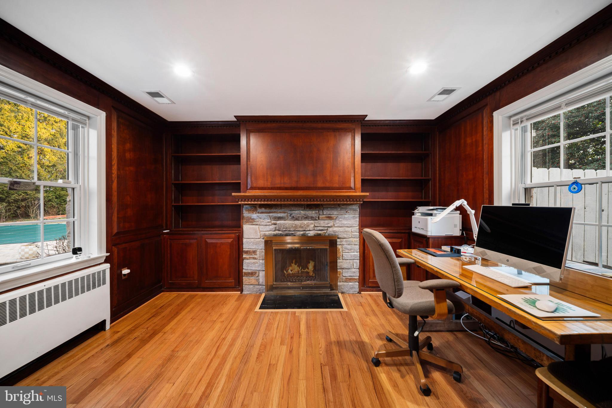 101 Thicket Road Baltimore, MD 21212 - Photo 15 of 30 a livingroom with workspace fireplace and dining area