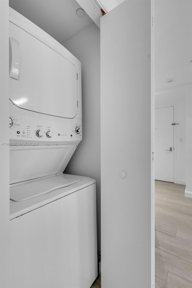 55 Southwest 9th Street, Unit 1109 Miami, FL 33130 - Photo 24 of 35 a utility room with dryer and washer