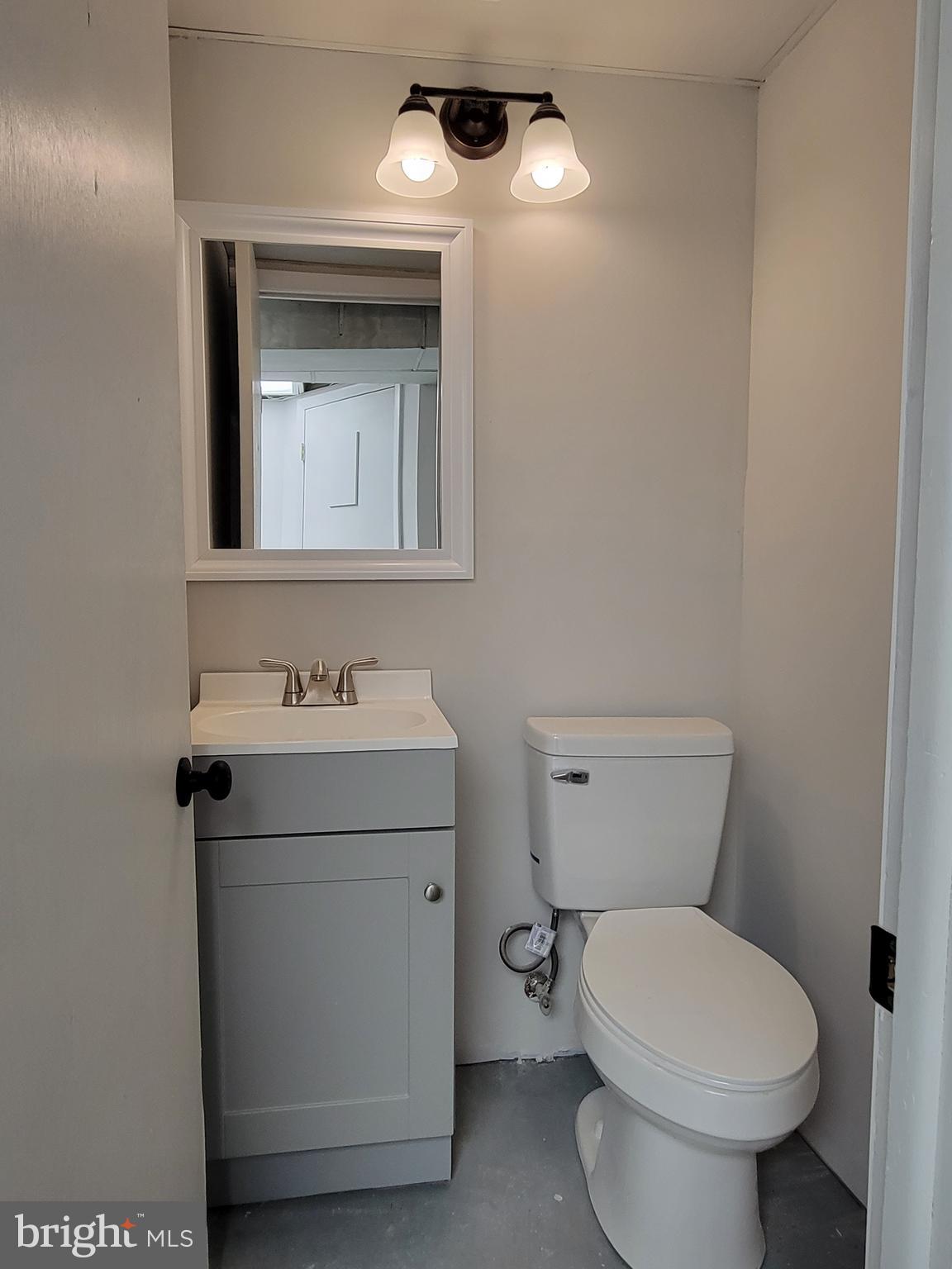 536 Crotzer Avenue Folcroft, PA 19032 - Photo 28 of 35 a bathroom with a toilet sink and mirror