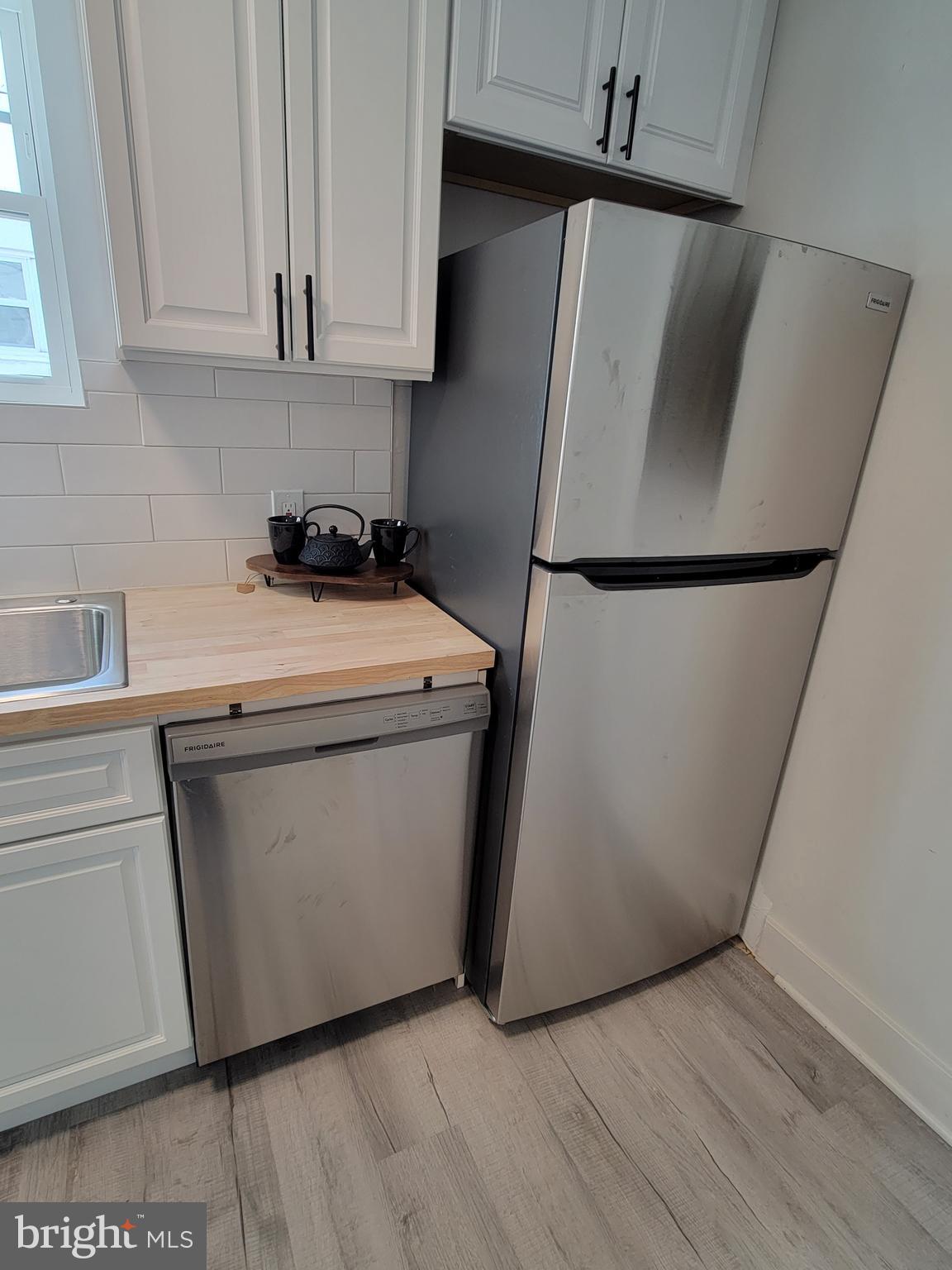 536 Crotzer Avenue Folcroft, PA 19032 - Photo 8 of 35 a utility room with wooden floor washer and dryer