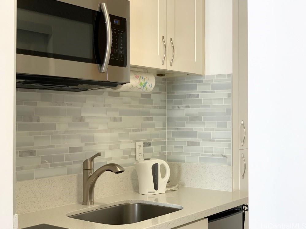 1920 Ala Moana Boulevard, Unit 2006 Honolulu, HI 96815 - Photo 4 of 7 a bathroom with a sink and a mirror