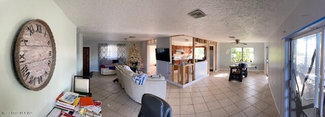 138 Bimini Road Cocoa Beach, FL 32931 - Photo 8 of 11 dining and living room