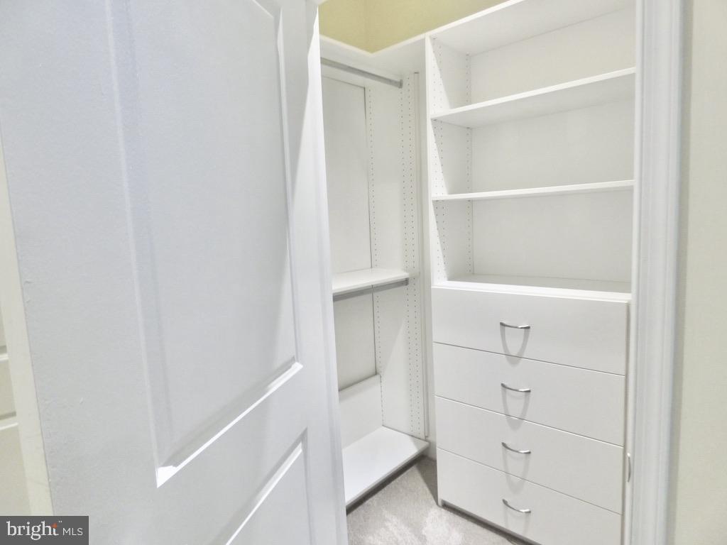 11800 Sunset Hills Road, Unit 118 Reston, VA 20190 - Photo 24 of 52 Sleek, modern closet with ample storage.