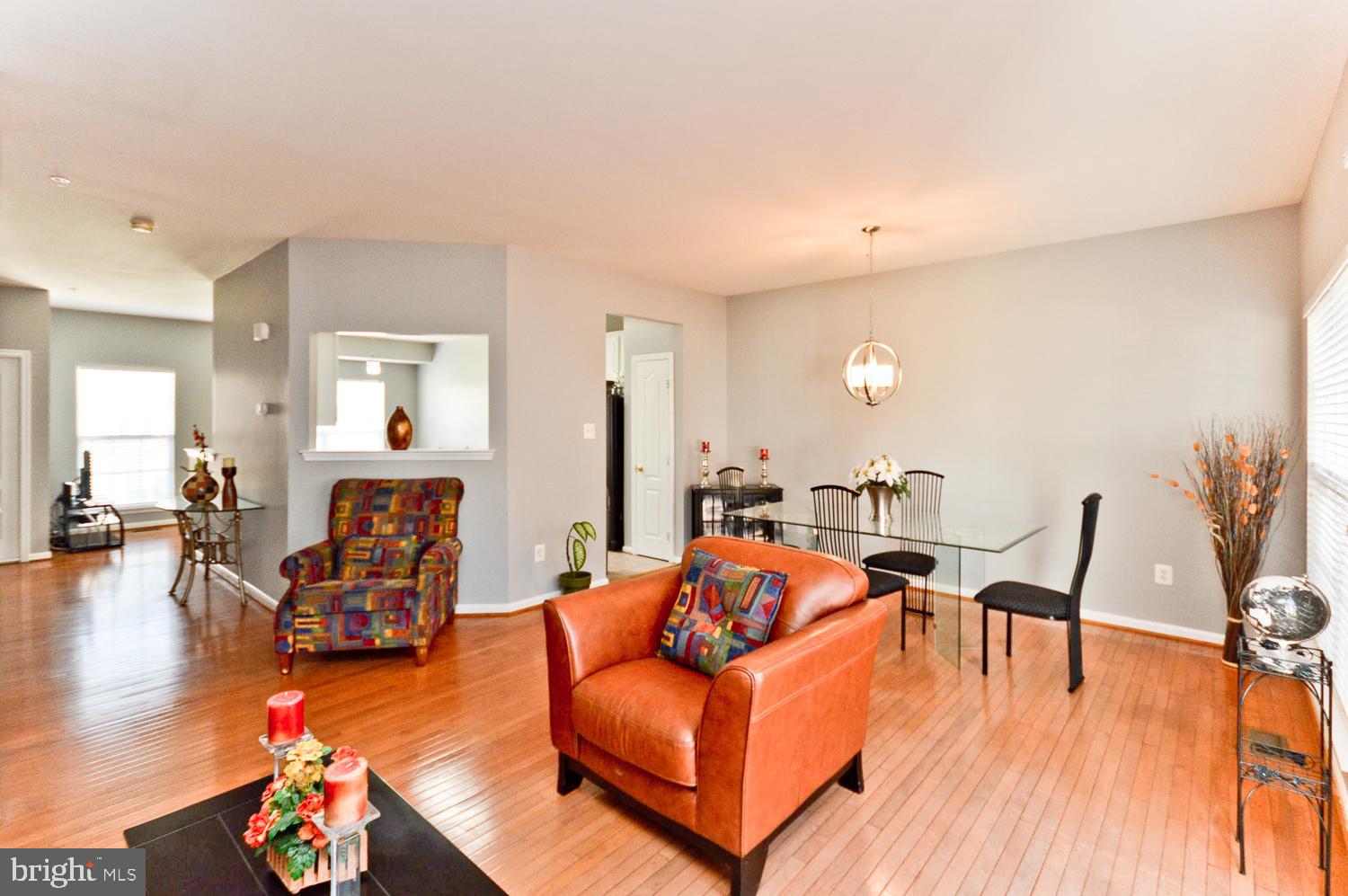 1113 Ring Bill Loop Upper Marlboro, MD 20774 - Photo 13 of 39 a living room with furniture and wooden floor
