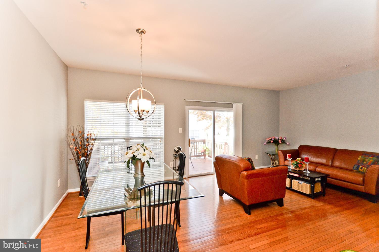 1113 Ring Bill Loop Upper Marlboro, MD 20774 - Photo 15 of 39 a living room with furniture lamps and wooden floor